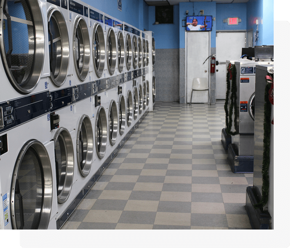 A row of washing machines in a room.